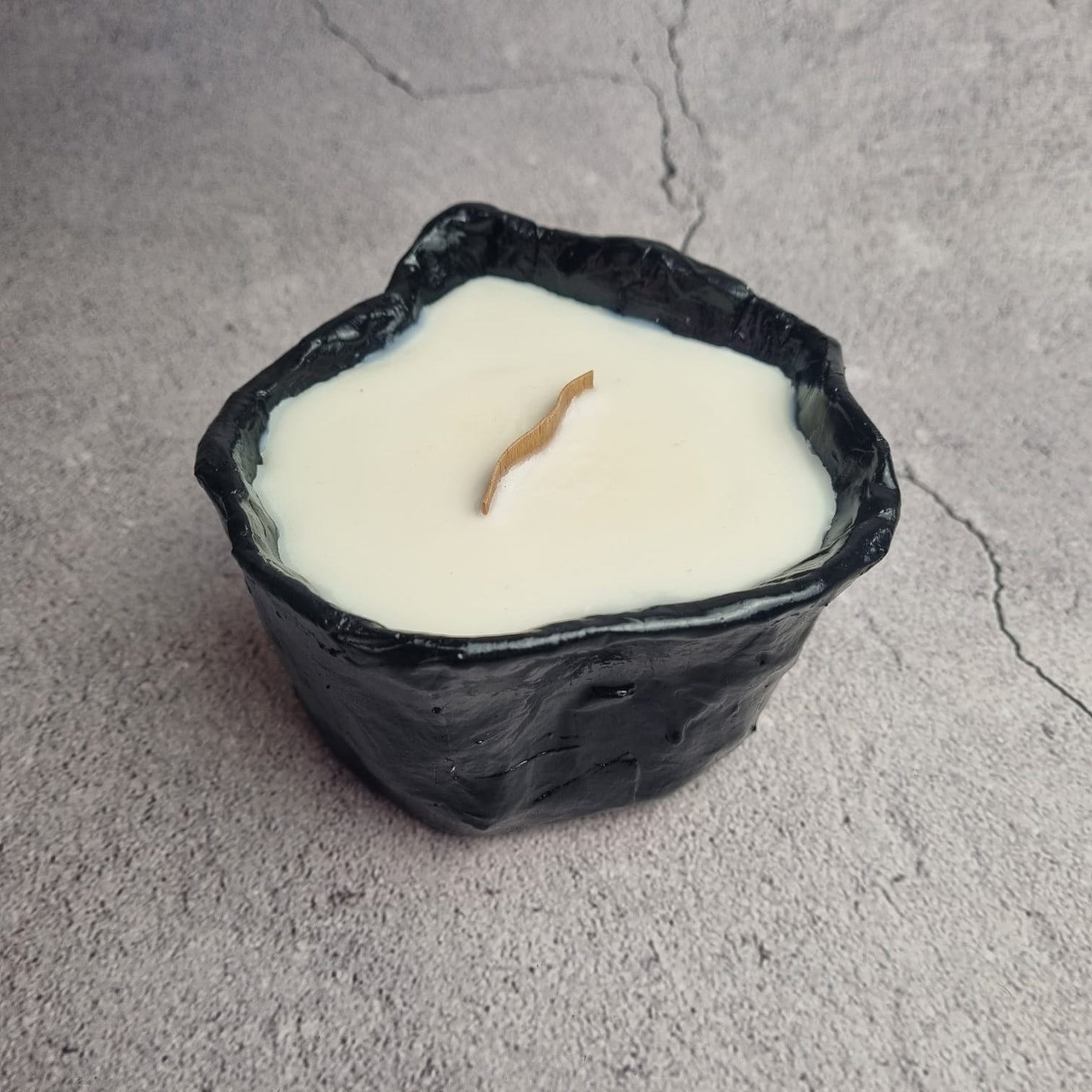 A candle in a basket