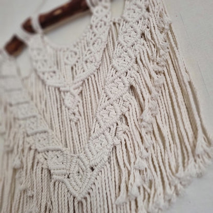 Macramé decoration on wood